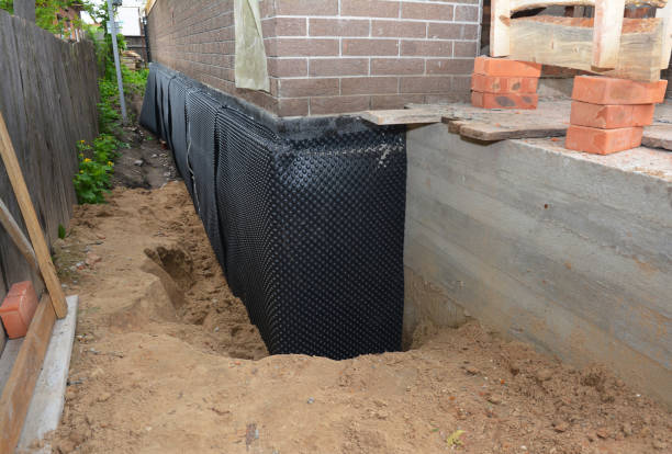 Happy homeowners after waterproofing job in Wartrace